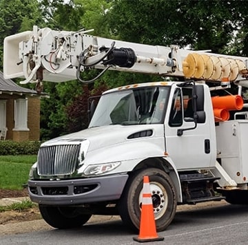 Utility truck parked on side of street